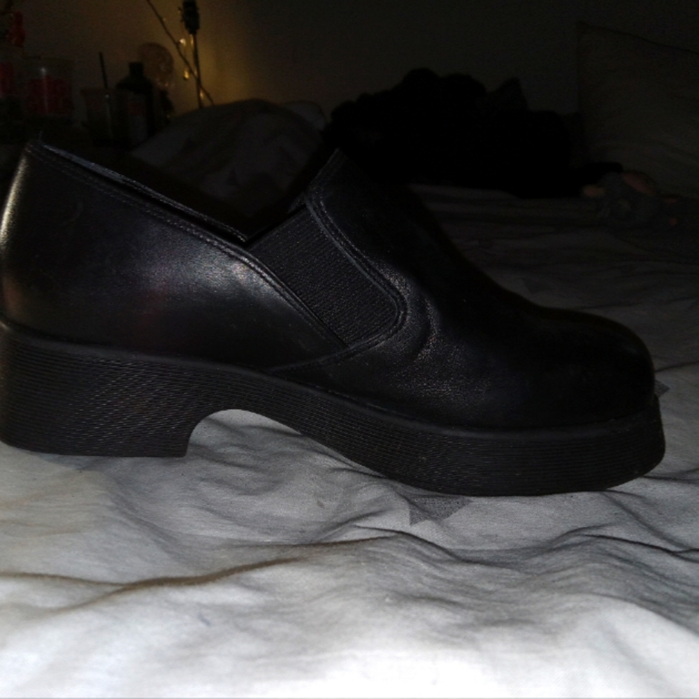 selling a pair of black slip on platform mules from Nine West